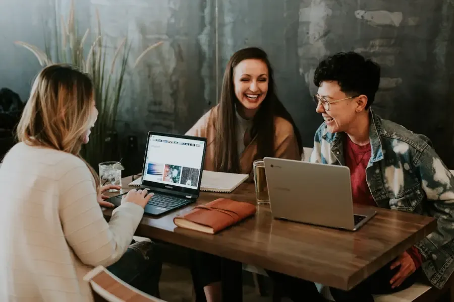 A digital nomad working remotely from a co-working space. Hong Kong's source-based tax system and simple compliance structure make it attractive for remote workers and international freelancers setting up a business base