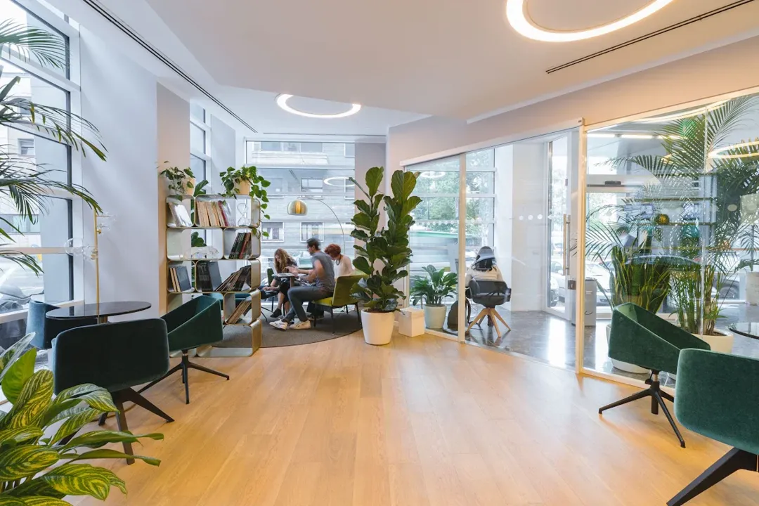 Employees in a modern Hong Kong office — the Employment Ordinance sets statutory minimums for leave, sick pay, and holiday entitlements that apply to all staff regardless of contract type