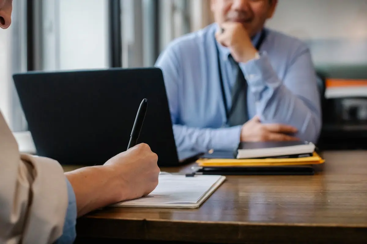 Company secretary reviewing compliance documents and filing deadlines for a Hong Kong company